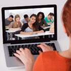 young lady in front of laptop learning online